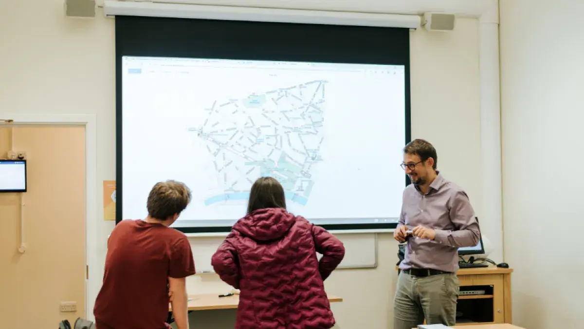 Teacher with Access Programme students in a classroom