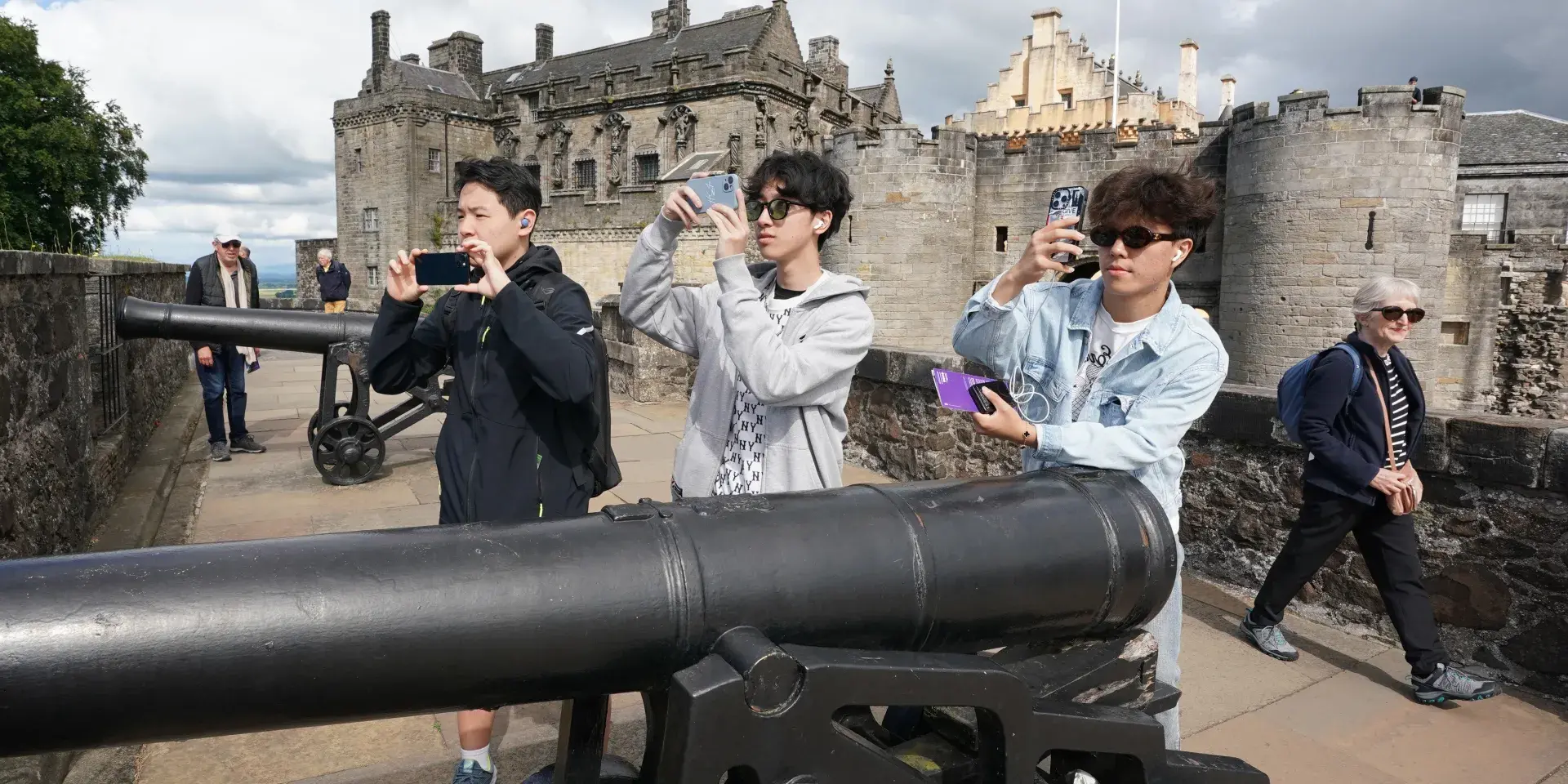 Summer School Students at Stirling Castle, boys pictured taking photos near cannons