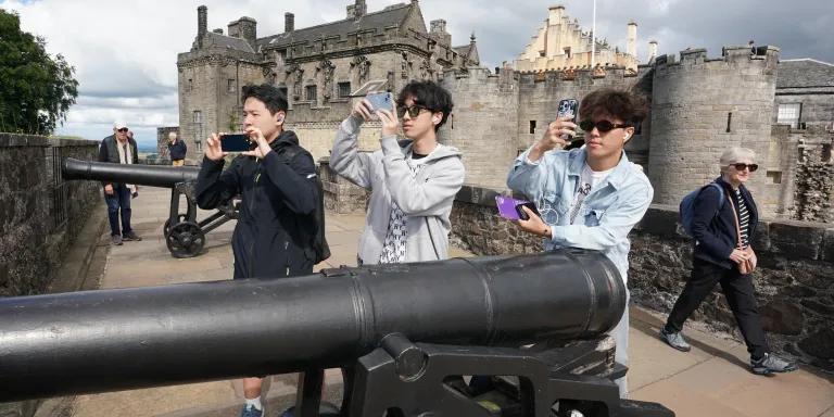 Summer School Students at Stirling Castle, boys pictured taking photos near cannons