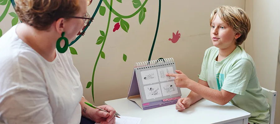 Child pointing at chart.