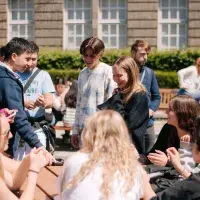 Students sitting outside in the Holyrood Campus quad