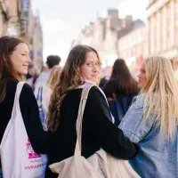 Students walking up the Royal Mile to go for afternoon tea at the Scotsman Hotel