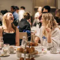 Students laughing at afternoon tea