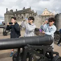 Three students standing beside the canon at Stirling Castle