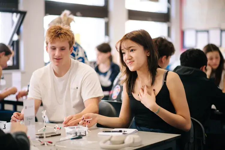 Two students at a table in a science class